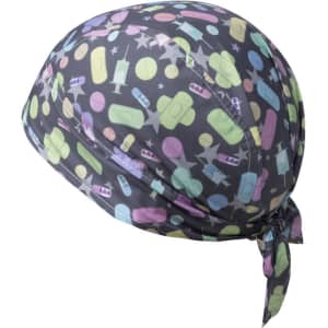A patterned bandana in grey featuring colourful shapes including stars, bottles, and circles, tied at the back.