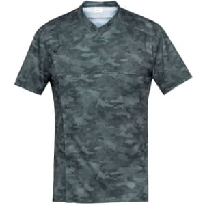 A camouflaged tunic in shades of grey and green, featuring a simple V-neck design and button detailing.