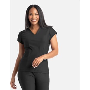 A woman in a black banded V-neck top smiles, with the top featuring short sleeves and a subtle logo.