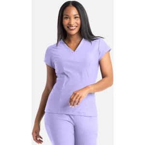 A woman wearing a lavender banded V-neck top. The top has short sleeves and a simple design.