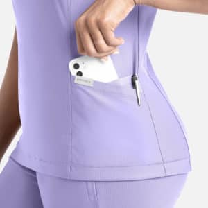 A lilac banded V-neck top featuring a side pocket with a phone and a pen. The top has a logo on it.