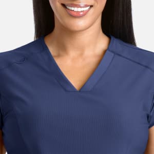 A navy blue banded V-neck top with short sleeves, featuring a logo on the shoulder.