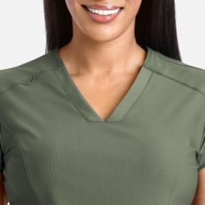 A banded v-neck top in olive green featuring a relaxed fit and a subtle logo.