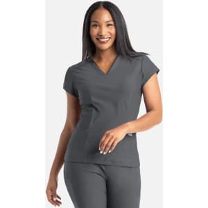 A grey banded V-neck top with short sleeves, worn by a smiling woman. The top features a logo on it.