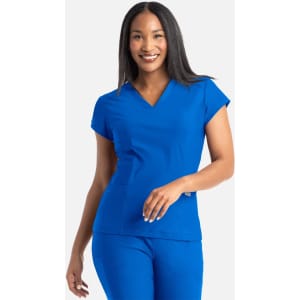 A blue banded v-neck top with short sleeves, featuring a logo on the chest, worn by a smiling woman.