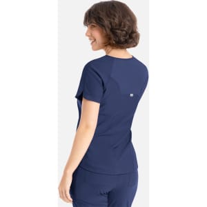 A navy blue Y-neck top with short sleeves and a slightly relaxed fit, featuring a logo on the back.