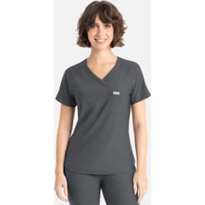 A woman wearing a dark grey Y-neck top with short sleeves, featuring a small logo.