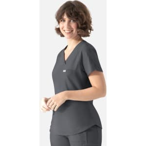 A dark grey Y-neck top with short sleeves and a small pocket, featuring a branding logo.