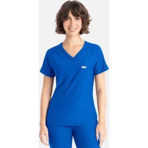 A woman wearing a blue Y-neck top with short sleeves and a small logo on the front.