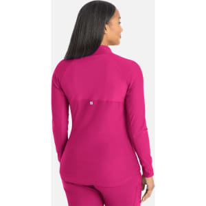 A full zip track jacket in vibrant pink with a fitted silhouette and a logo on the back.