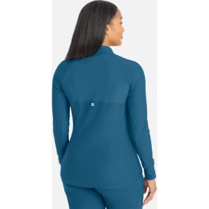 A track jacket in teal with a high collar and a logo on the back, featuring a full zip design.