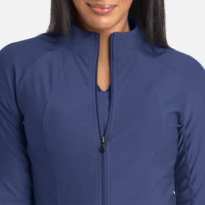 A full zip track jacket in navy blue, featuring a high collar and sleek, fitted design. It has a logo.