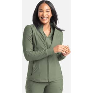 A zipped, full track jacket in olive green, featuring a collar and smooth fabric. The model is smiling and standing.