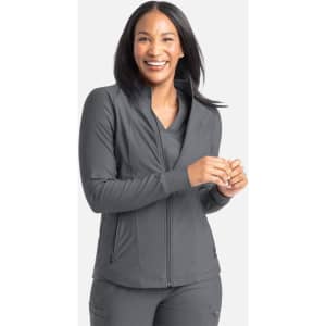 A full zip track jacket in grey, featuring a stylish collar and a fitted design, worn by a smiling woman.