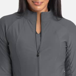 A full zip track jacket in grey, featuring a fitted design and a high collar, accompanied by a logo.
