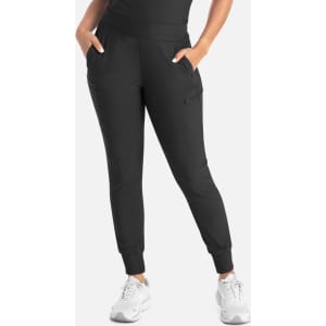 A black mid-rise jogger with pockets, featured on a model standing with hands in pockets, wearing white sneakers.