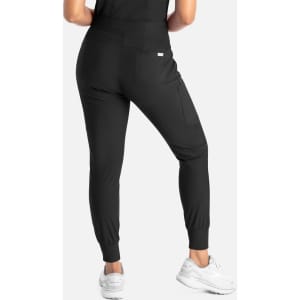 A pair of black mid-rise joggers with a tapered fit and a side pocket, worn with white sneakers.