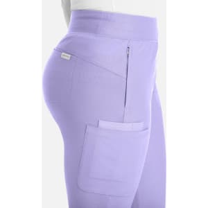 A pair of mid-rise joggers in a light lavender colour, featuring side pockets and a logo.