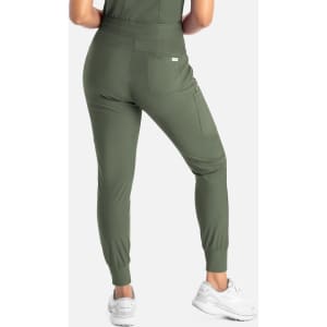 A pair of mid-rise joggers in olive green, featuring a pocket and fitted cuffs, worn with white sneakers.