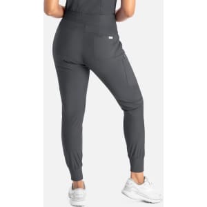 Mid-rise jogger in dark grey with fitted cuffs and a side pocket, modelled from the back. Features a branding logo.