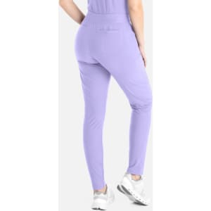 A pair of lilac tapered leg pants with an elastic waistband and back pocket, modelled from the back.