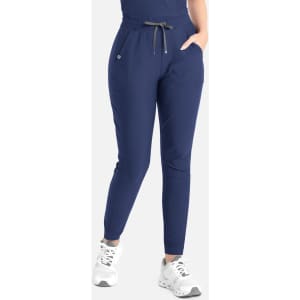 A pair of navy tapered leg pants with an elastic waistband and drawstring, featuring side pockets.