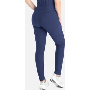 A pair of navy tapered leg pants with a back pocket, displayed on a model from the rear.