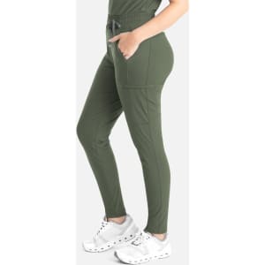 A pair of olive green tapered leg pants featuring side pockets and an elasticated waistband.