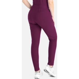 A pair of tapered leg pants in a deep plum colour, featuring a back pocket and a fitted design.