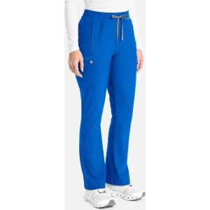 A pair of blue bootcut pants with a drawstring waistband, featuring pockets and a logo.
