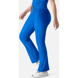 Embrace Nora Bootcut Pant in bright blue, featuring a comfortable fit and a side pocket, presented on a model.