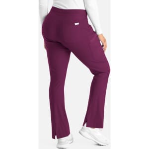 A pair of purple bootcut pants with a snug waistband and a back pocket, featuring a logo.