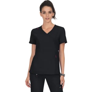 A black top with a crossover design, featuring short sleeves and pink accents, worn by a model. It has a logo.