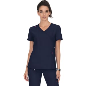 A navy blue scrubs top with a V-neck and short sleeves, featuring a logo and pink accents.