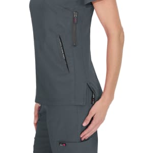 A dark grey top with pockets and zippers, featuring a fitted design and a logo on the side.