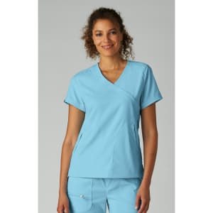 A top in light blue, featuring a V-neck design and short sleeves, worn by a smiling model.