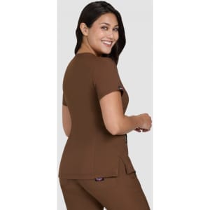 A brown top with short sleeves, featuring a logo on the side, designed for a stylish and comfortable fit.