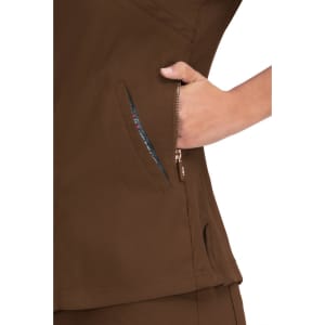 A brown top featuring a zippered pocket on the side, showcasing a colourful inner lining.