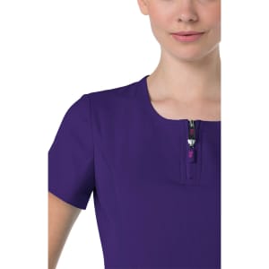 A purple top with a zippered neckline, featuring short sleeves and a close-fitting design.