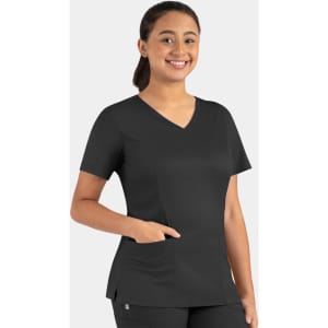 A woman wearing a black Matrix Women's Double V-Neck Top, featuring a pocket and a modern fit.