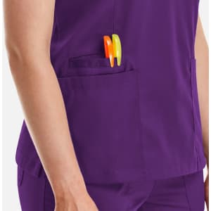 A purple women's top with a double V-neck and two pens in the pocket.