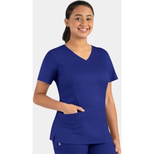 A woman wearing a blue double V-neck top with short sleeves and a front pocket, featuring a logo.