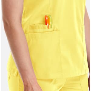 A yellow women's double V-neck top featuring a pocket with pens. The top has a simple, professional design.
