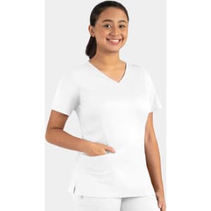 A woman in a white double v-neck top with short sleeves and a pocket, smiling against a light background.