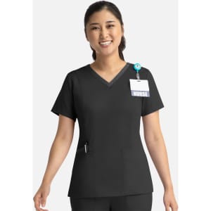 A black women's top with a double V-neck and short sleeves, featuring a pocket and a badge holder.