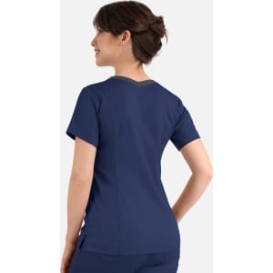 A women's navy blue double V-neck top with a contrasting design at the back and a logo.
