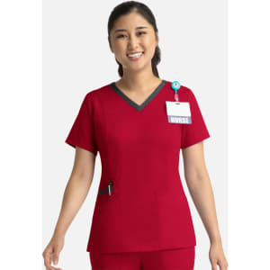 A red women's double V-neck top with a contrasting neckline, featuring a pocket and a badge holder.