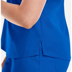 A close-up of a vibrant blue women's V-neck top featuring a tuckable design and side slit. The top has a branding logo.