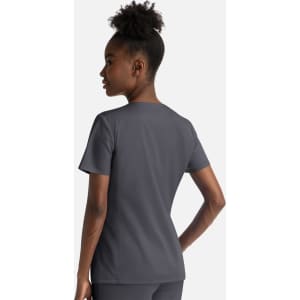 A grey women's notched crew neck top with short sleeves, featuring a fitted design and a logo on the back.