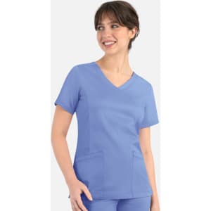 A women's mock wrap top in light blue, featuring short sleeves and two front pockets, with a subtle logo.